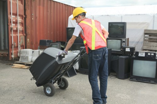 Office furniture being removed by clearance services